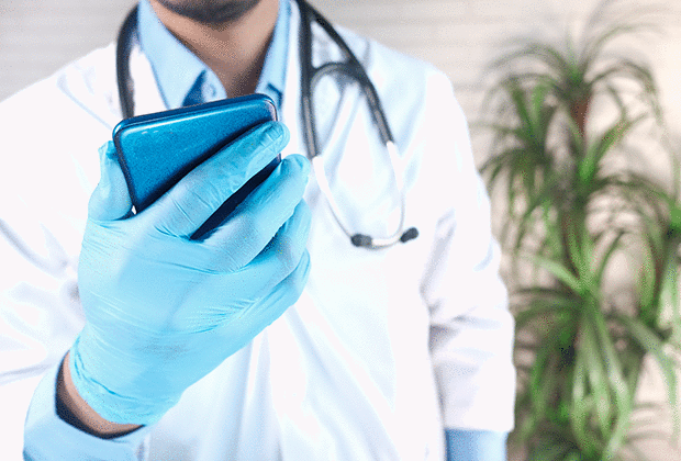 doctor_holding_sparkly_blue_phone
